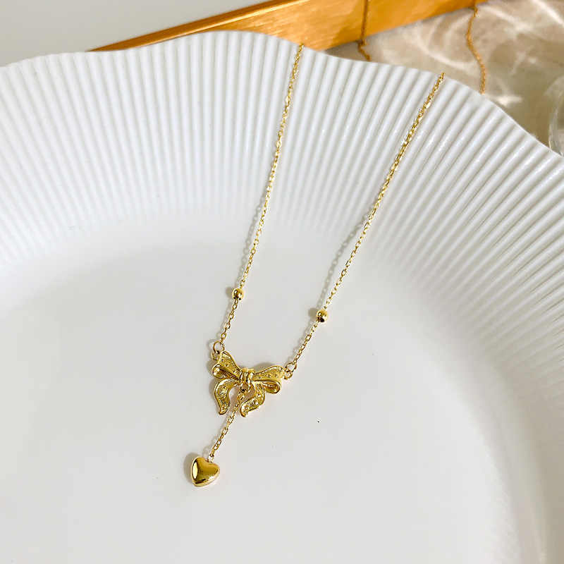 Gold bow necklace women's new tassel love clavicle chain premium sweater chain