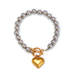 Silver Bead Bracelet with Gold Heart Pendant, Elegant and Minimalist Design