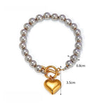 Silver Bead Bracelet with Gold Heart Pendant, Elegant and Minimalist Design