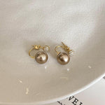 Two wearing pearl earrings, new hot style, high end unique earrings, women's light luxury temperament, atmospheric earrings