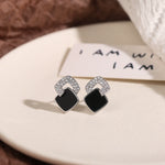 Stylish black stud earrings for women, 925 sterling silver, offering a touch of luxury & elegance, perfect for enhancing refined & sophisticated looks